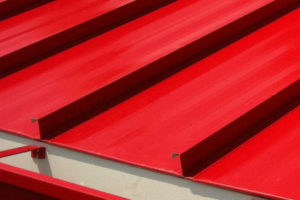 Central Span Metal Roofing in Autumn Red