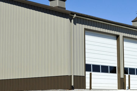 Fire House Metal Building with Tan Metal Siding and Brown Metal Roofing